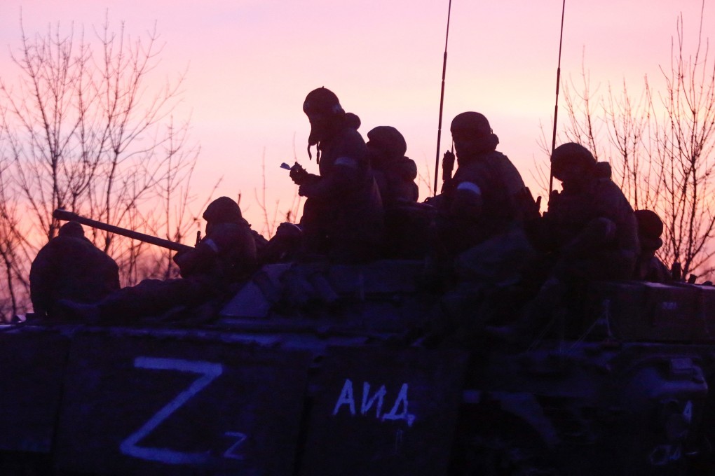 Pro-Russian troops outside the besieged southern port city of Mariupol in Ukraine.  Photo: Reuters