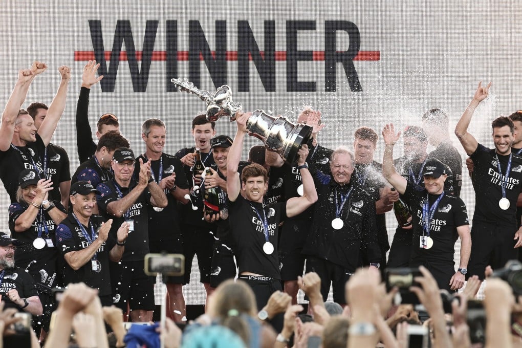 Emirates Team New Zealand helmsman Peter Burling holds the America’s Cup trophy aloft after beating Italian challenger Luna Rossa 7-3 in the 36th match for sailing’s oldest trophy. Photo: AP