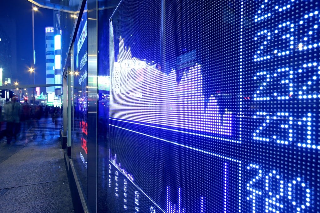 Stock quotes at the Hong Kong stock exchange. Photo: Frank Cheng