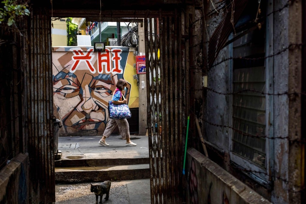 A woman walks through an alley in the Talad Noi neighbourhood, long home to the ethnic Chinese communities of Bangkok. Photo: AFP