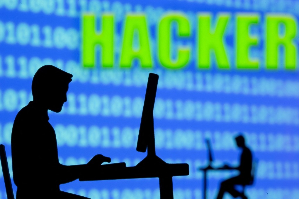 This arranged illustration shows a 3D printed model of hackers using computers, July 5, 2021. Photo: Reuters