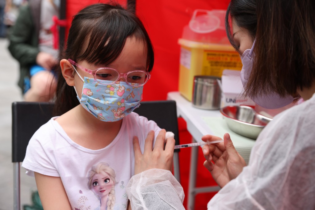 A child receives a free Covid-19 jab during a vaccination event at Hoi Ying Estate in Cheung Sha Wan on March 22. Photo: Nora Tam