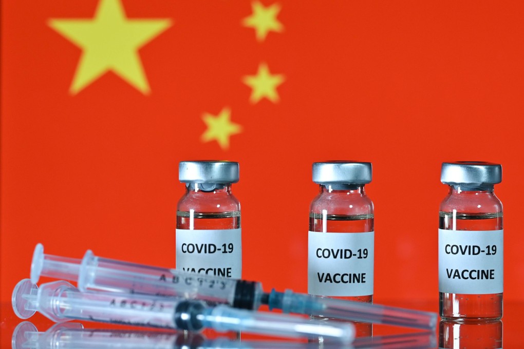 An illustration picture shows vials with Covid-19 Vaccine stickers attached, and syringes, with the national flag of China, on November 17, 2020. (Photo by JUSTIN TALLIS / AFP)