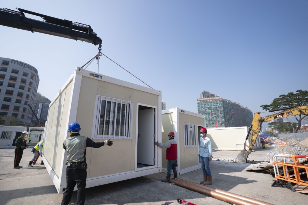 Construction workers put together the Tsing Yi mobile cabin hospital in Hong Kong on February 26, part of the rapid construction of temporary isolation and treatment facilities amid a surge in Covid-19 infections. Photo: Xinhua