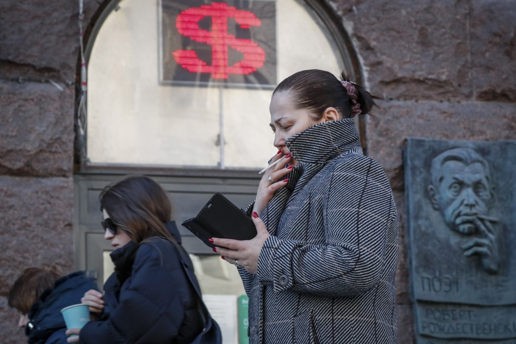 A woman walks past a currency exchange office in Moscow, Russia, on March 21. Western countries have imposed an unprecedented level of sanctions on Russia in the wake of its invasion of Ukraine. Photo: EPA-EFE