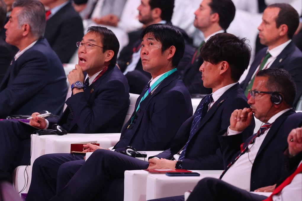 Japan’s coach Hajime Moriyasu (centre) waits for the draw for the 2022 World Cup in Qatar at the Doha Exhibition and Convention Centre. Photo: AFP