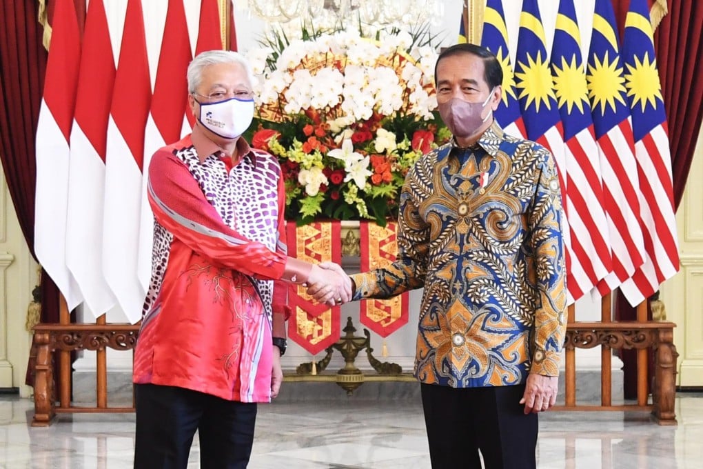 Indonesia’s President Joko Widodo, right, greeting Malaysia’s Prime Minister Ismail Sabri Yaakob at the Merdeka Palace in Jakarta. Photo: EPA