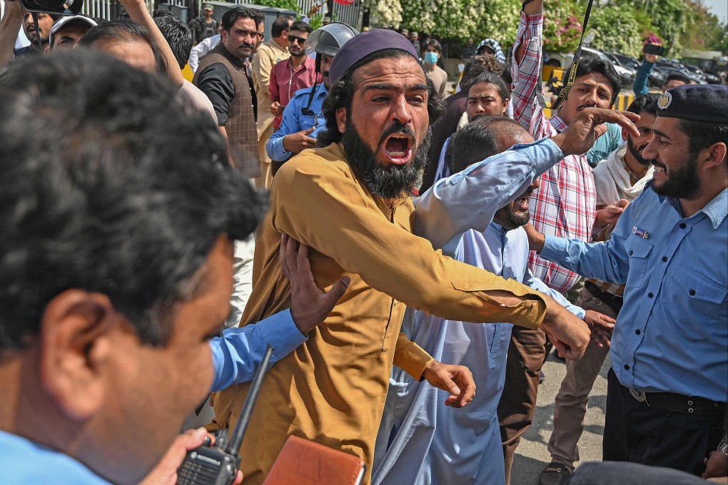 Supporters of the PTI gather outside Parliament House in Islamabad on April 3, 2022. Photo: AFP