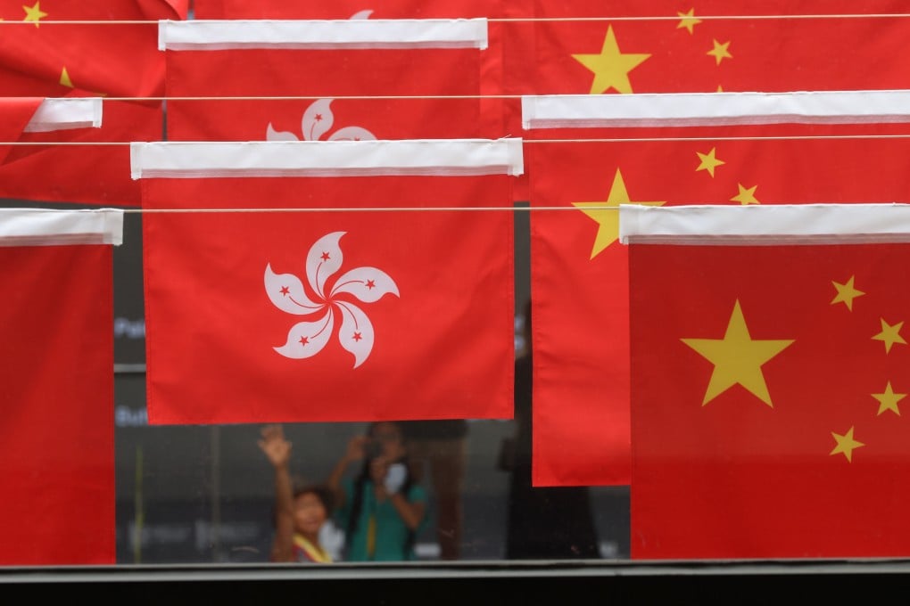 Hong Kong and Chinese flags fly in Central Market for National Day, on September 30, 2021. Chinese leaders are committed to upholding “one country, two systems”. Photo: Dickson Lee
