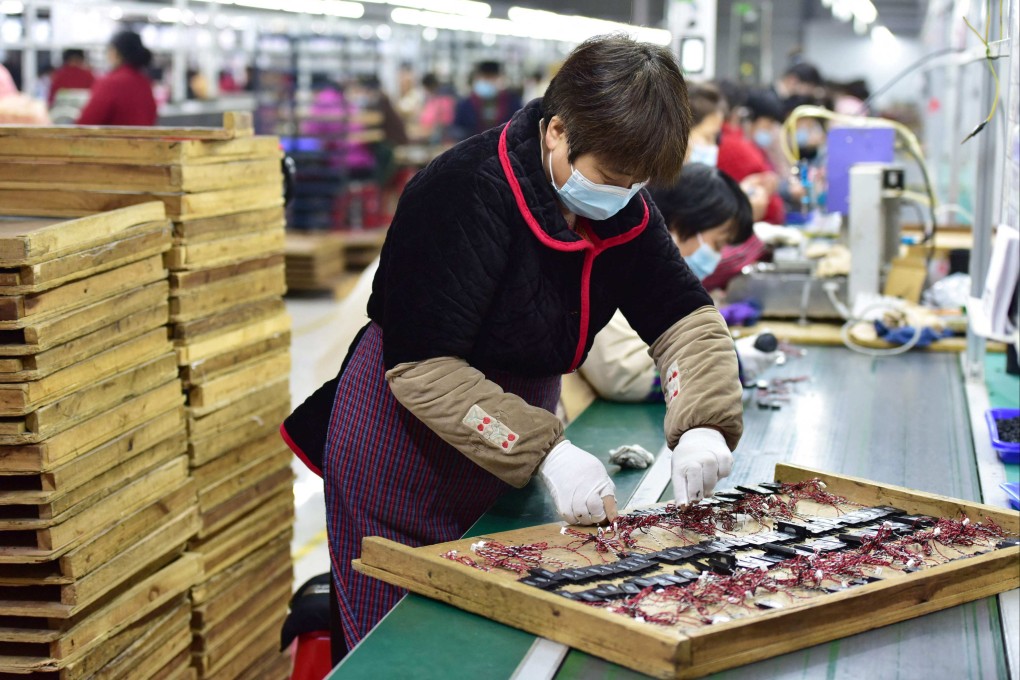 An employee works on an assembly line producing speakers at a factory in Fuyang, in eastern Anhui province, on March 31. Purchasing managers indices for manufacturers in China are showing worrying signs for the economy as domestic and global factors weigh on economic growth. Photo: AFP