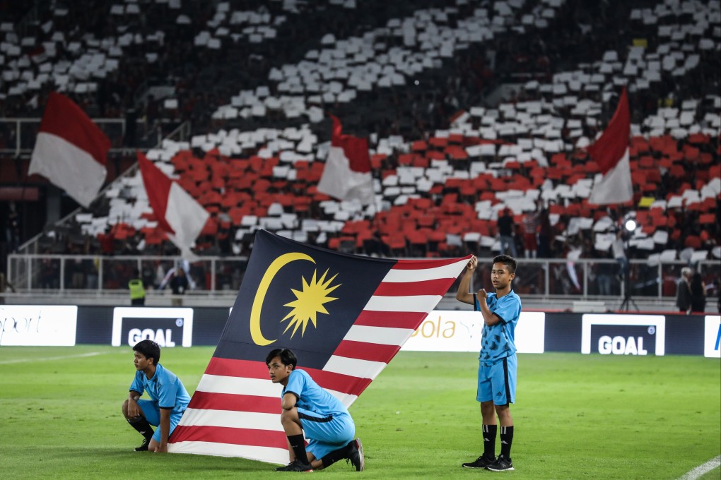 The Malaysian flag is displayed before a Fifa World Cup 2022 qualifying match against Indonesia at the Gelora Bung Karno stadium in Jakarta. Photo: Getty Images