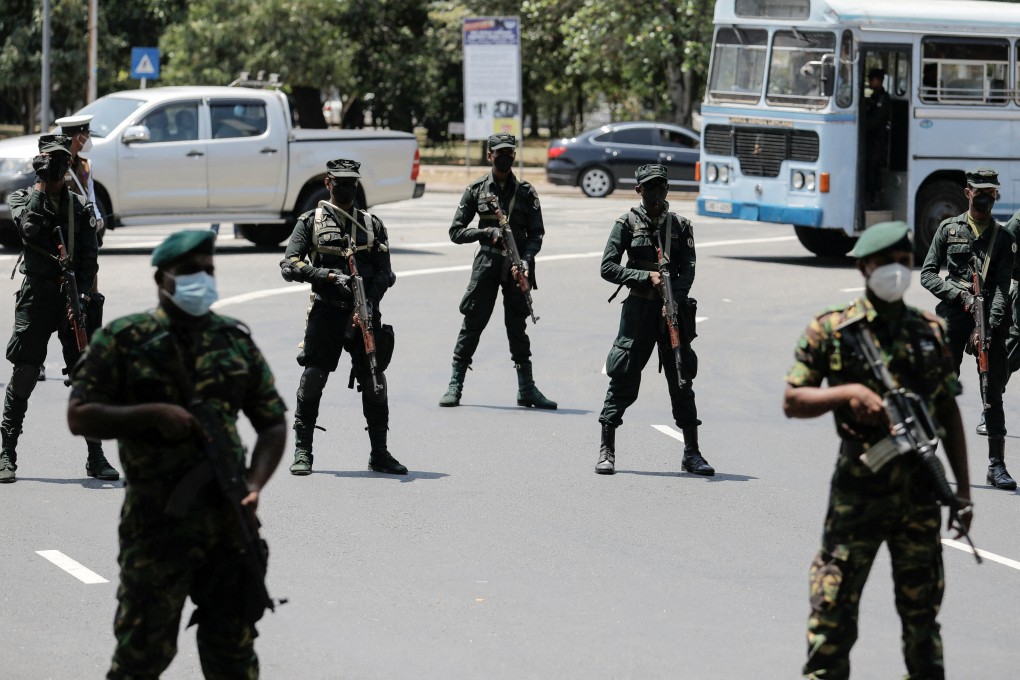 Sri Lankan army soldiers stand guard near Independence Square as opposition alliance Samagi Jana Balawegaya party members protest against President Gotabaya Rajapaksa in Colombo, Sri Lanka, on Sunday. Photo: Reuters