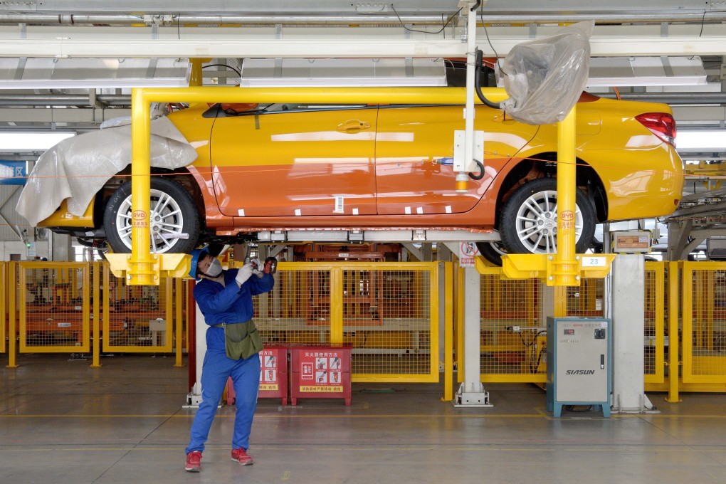 A worker works on the assembly line at a factory of vehicle manufacturer BYD in Xian. Photo: Xinhua