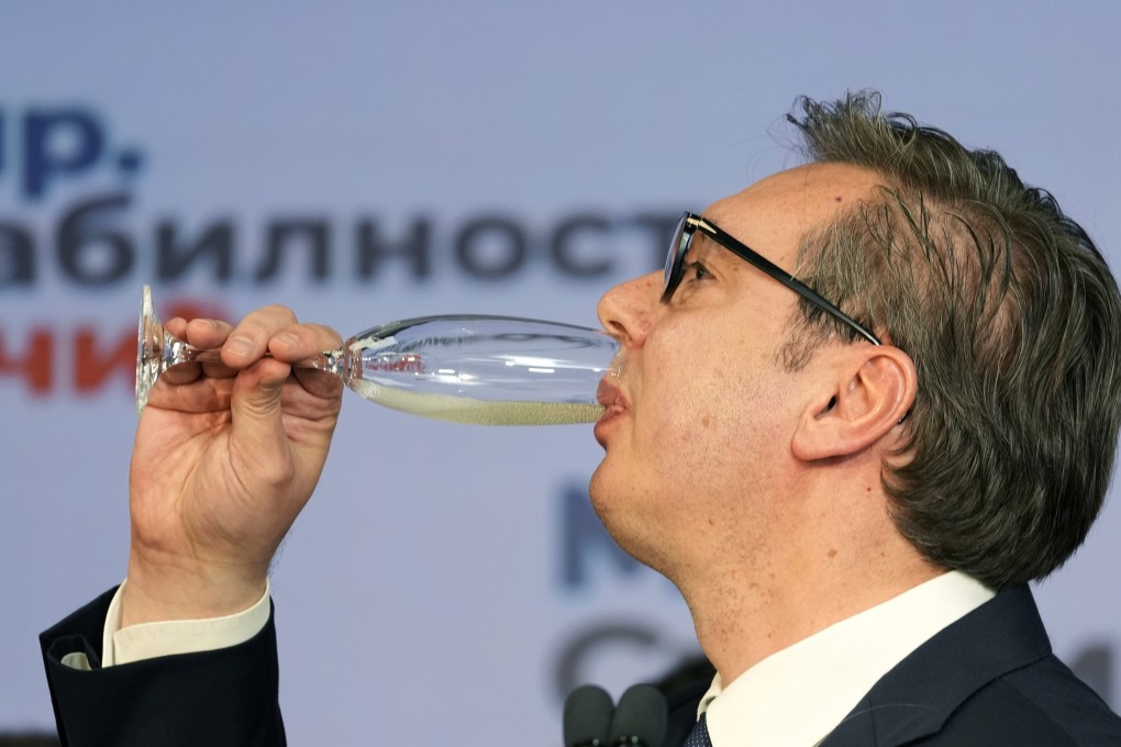 Serbian President and presidential candidate Aleksandar Vucic drinks champagne after claiming victory in the presidential election in Belgrade, Sunday, April 3, 2022. Photo: AP