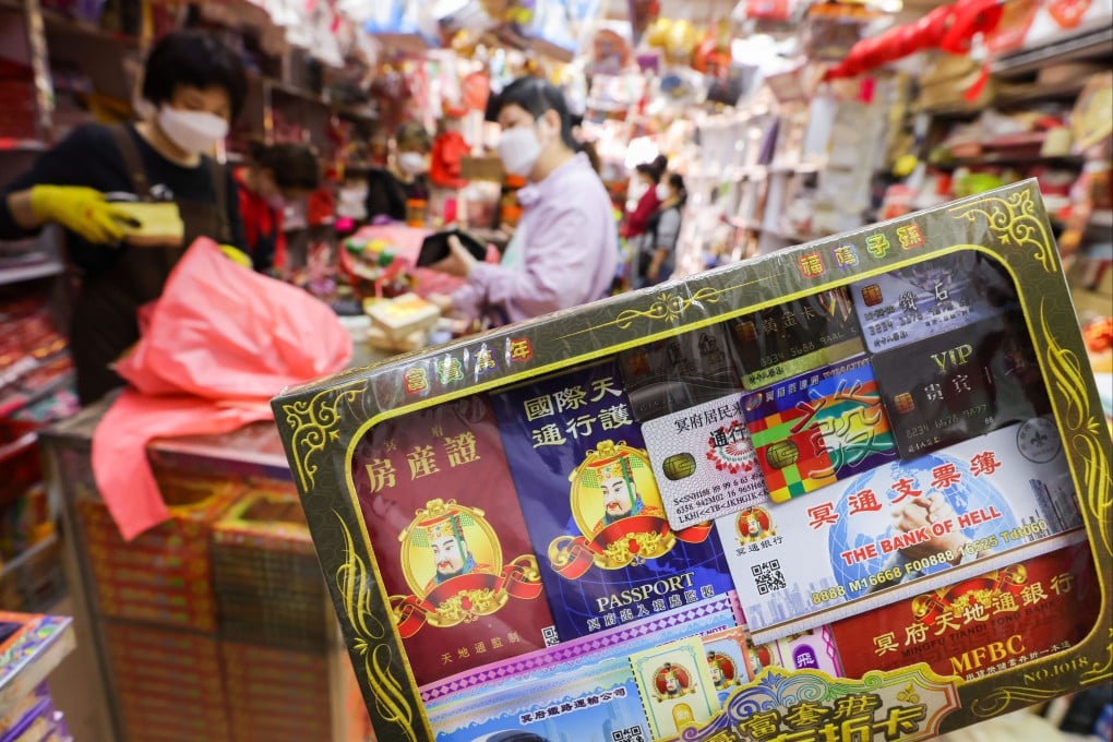 Paper offerings resembling passports, mainland travel permits as well as flight and train tickets have become the most sought-after items during this year’s Ching Ming Festival. Photo: Nora Tam