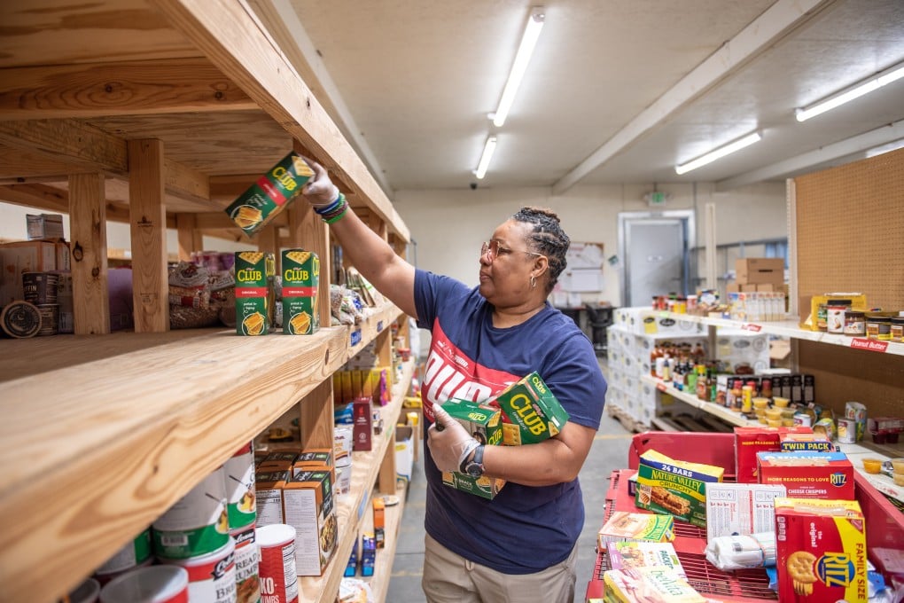 A worker organises food at the West Alabama Food Bank in Northport, Alabama, on March 28. Inflation is driving up operating costs for food banks and pantries across the US and forcing them to ration their aid, but there are fears the Federal Reserve’s attempts to rein in inflation could lead to a recession. Photo: Bloomberg