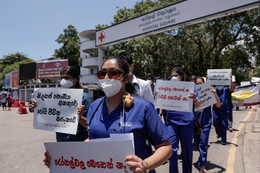Medical workers with placards protest against Sri Lanka’s President Gotabaya Rajapaksa during the country’s worst economic crisis. Photo: Reuters