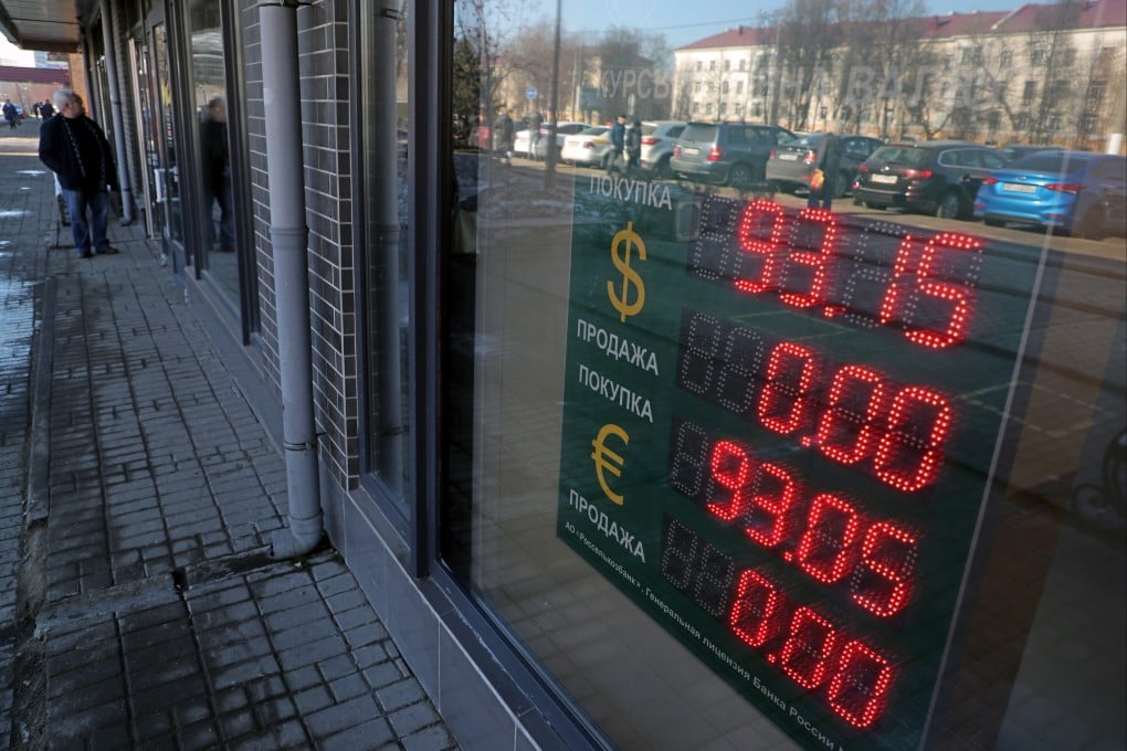 An electronic panel displays currency exchange rates for the US dollar and euro against the Russian rouble in Podolsk, Russia, on March 24. Some commentators have speculated that the “weaponisation” of the US dollar in sanctions against Russia could ultimately undermine the US currency. Photo: EPA-EFE