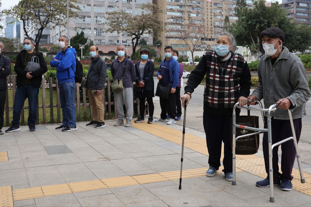People queue at the Kowloon Bay Sports Centre to receive the BioNTech Covid-19 vaccine earlier this year. Photo: May Tse