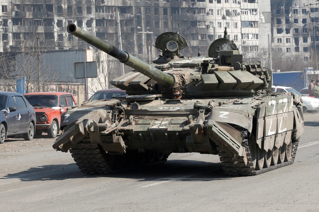 A Russian tank drives through Mariupol as Ukraine calls for more weapons to help its defence. Photo: Reuters