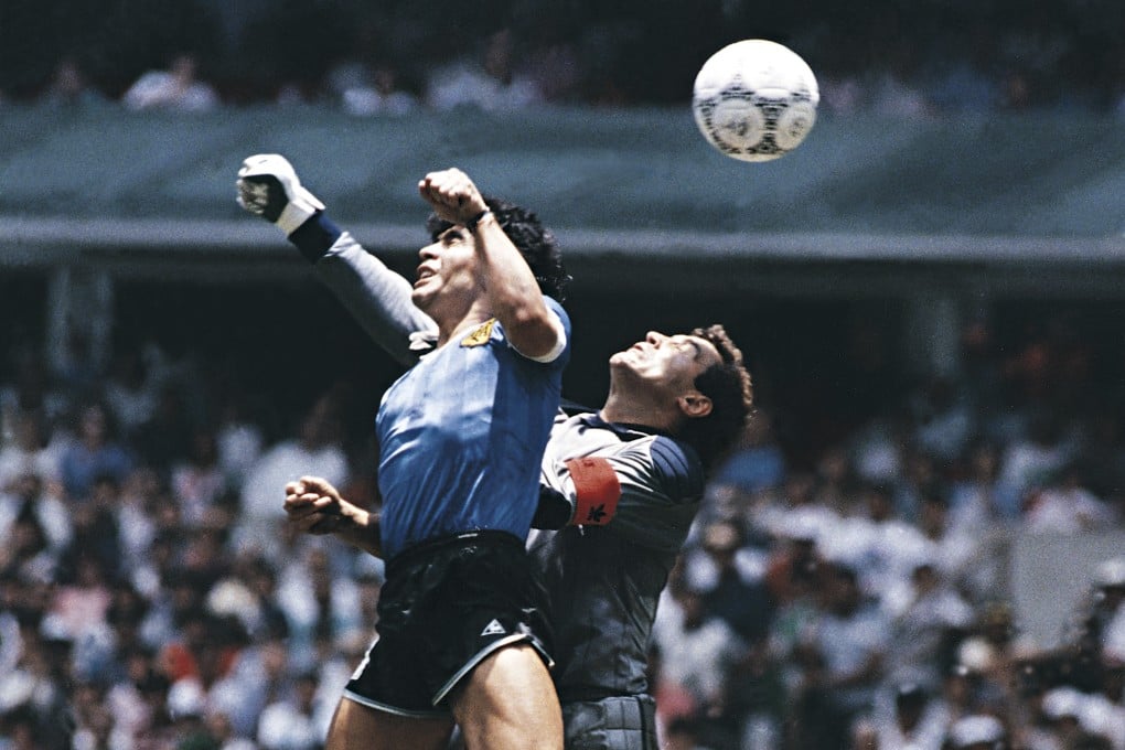 Diego Maradona cheats by using his hand to score Argentina’s first goal in the 1986 Fifa World Cup quarter-final against England. Photo: Getty Images
