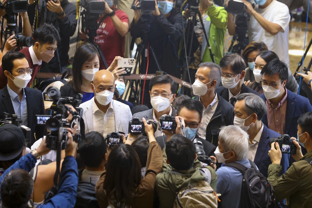 Hong Kong chief executive hopeful John Lee meets the media at Central Plaza in Wan Chai on Friday. Photo: Dickson Lee