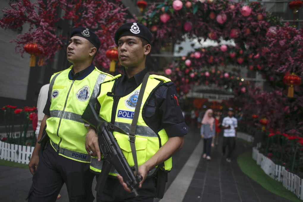 Malaysian police patrol outside a shopping mall at Kuala Lumpur. File photo: EPA