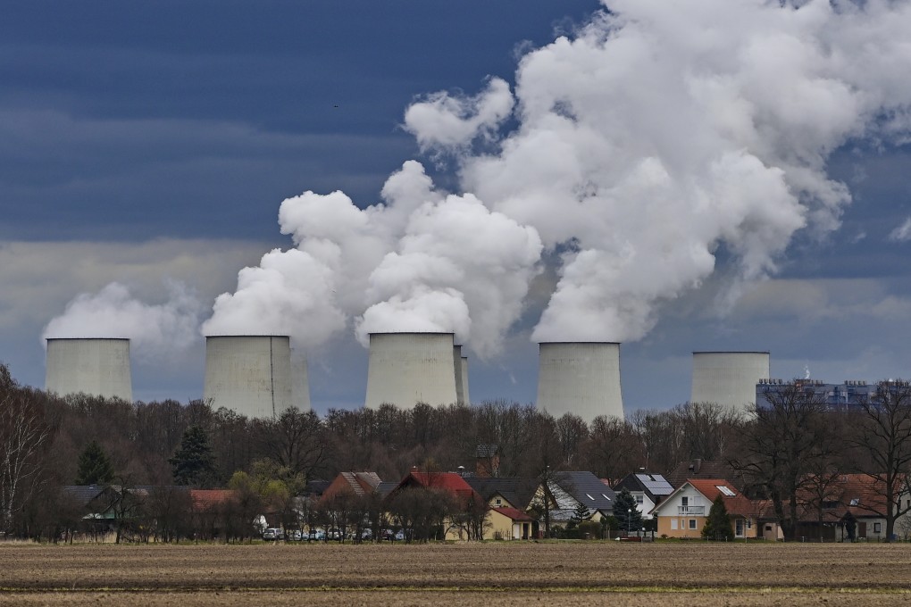 Steam rises from cooling towers at a power plant in J’nschwalde, Germany on Tuesday. Photo: dpa via AP