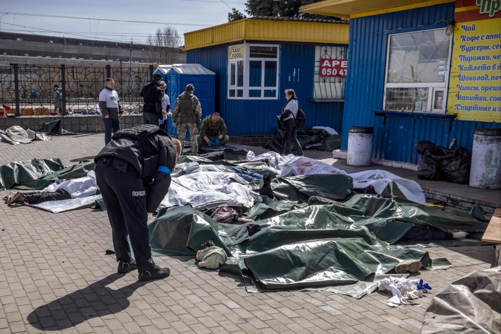 Bodies covered with tarpaulin after a rocket attack killed at least 35 people at a train station in Kramatorsk. Photo: AFP