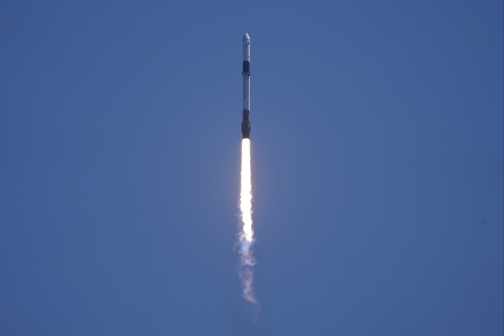 A SpaceX Falcon 9 rocket with the Crew Dragon capsule attached, lifts off from the Kennedy Space Centre. Photo: AP