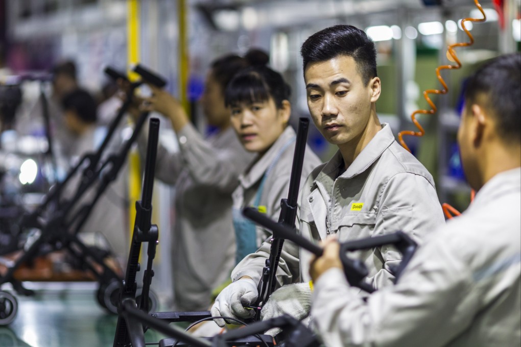 Workers assemble strollers at the Good Baby factory in Kunshan city on 17 October 2018. Photo: EPA-EFE