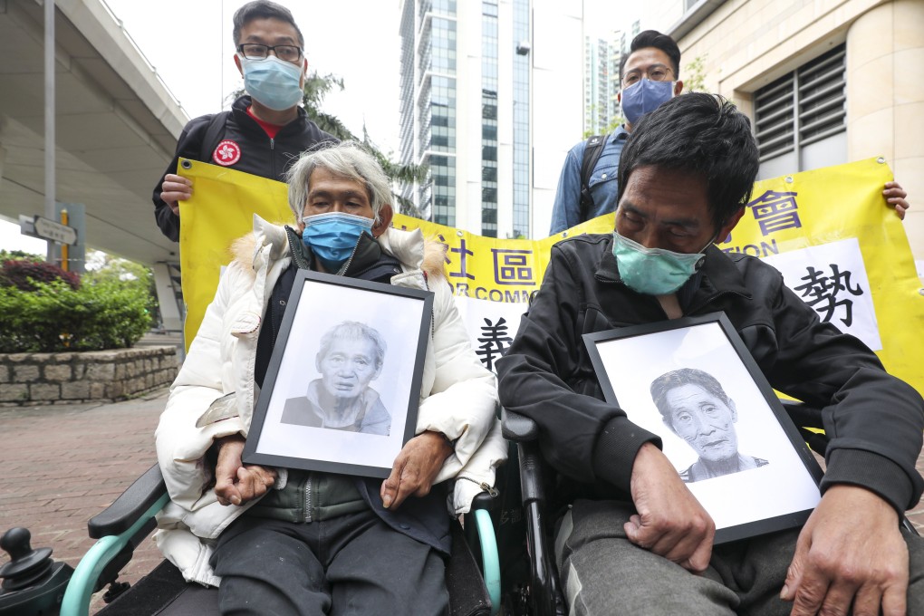 Accompanied by social workers,  two homeless men holding photos of their deceased friends arrive at West Kowloon Court for the Small Claims Tribunal’s verdict in March. Photo: Xiaomei Chen
