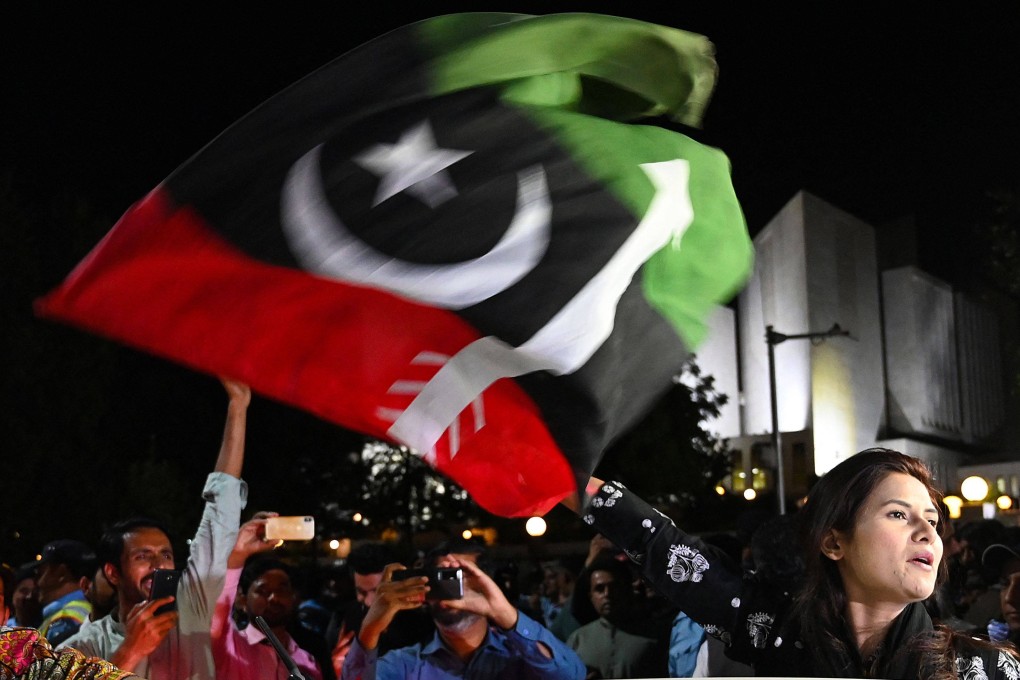 Opposition party activists celebrate in Islamabad after Pakistan’s Supreme Court ruled against Prime Minister Imran Khan on Thursday. Photo: AFP