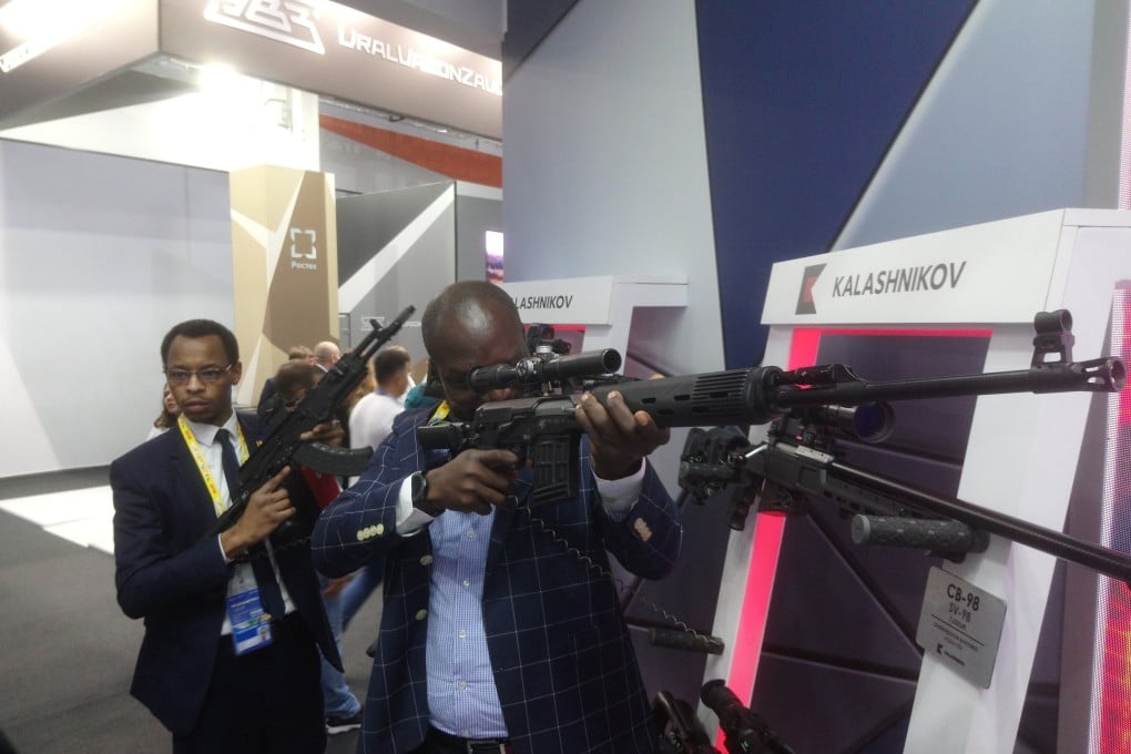 Visitors examine Kalashnikovs at the 2019 Russia-Africa summit in Sochi. Photo: Getty Images