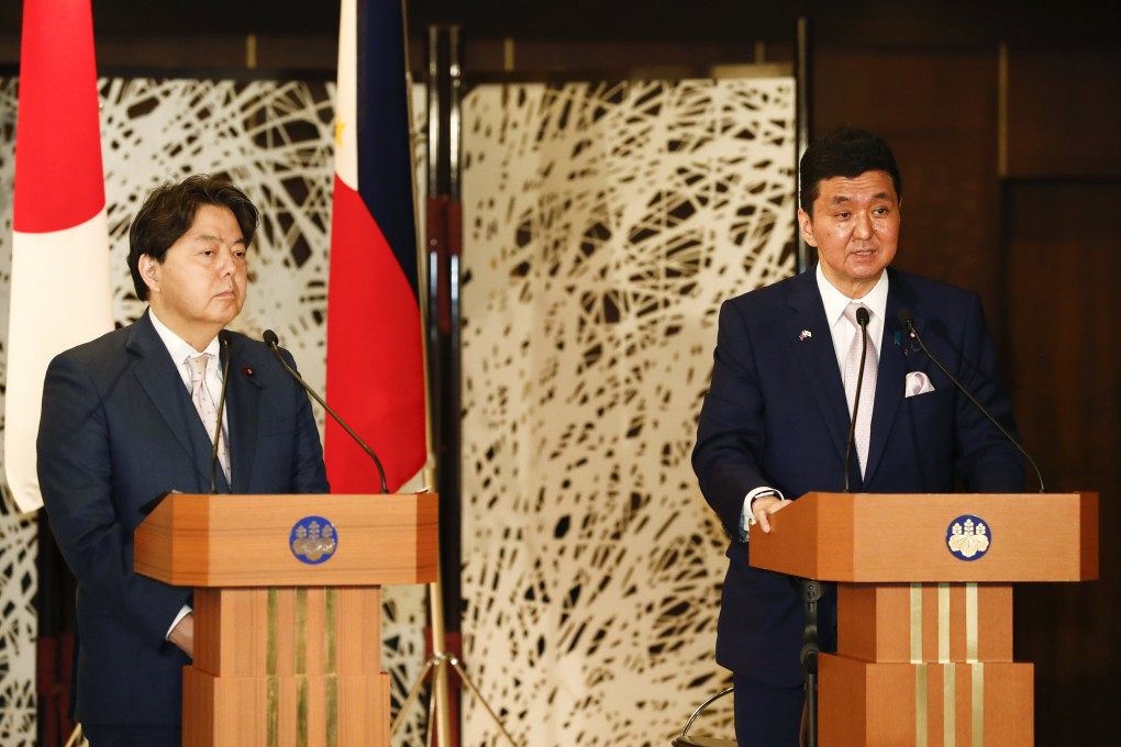 Japanese Foreign Minister Yoshimasa Hayashi, left, and Defense Minister Nobuo Kishi hold a news conference with Philippine Defense Secretary Delfin Lorenzana and Foreign Secretary Teodoro Locsin Jr. in Tokyo on Saturday. Photo: Pool Photo via AP