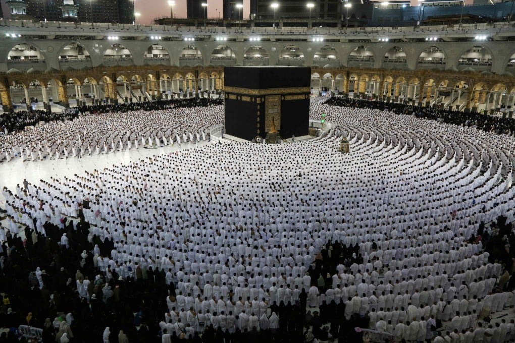 Muslims pray around the Kaaba, Islam’s holiest shrine, at the Grand Mosque complex in the Saudi city of Mecca on April 9. Saudi Arabia said it will permit one million Muslims to participate in this year’s hajj. Photo: AFP