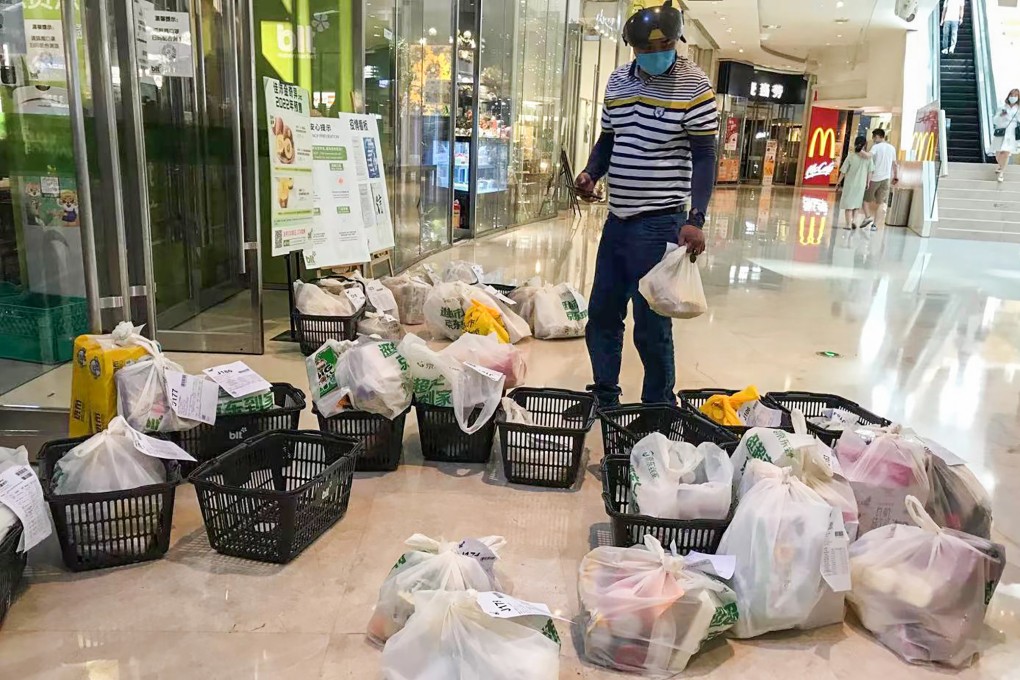 Bags of vegetables piled up in front of a supermarket in Guangzhou.  Photo: Handout