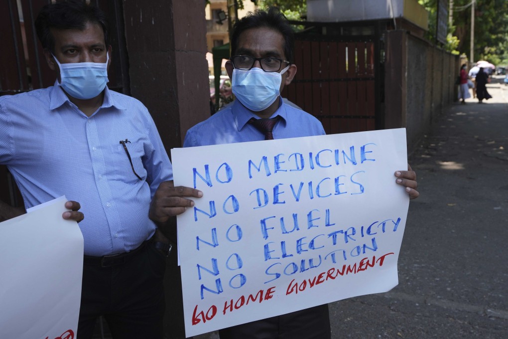 Sri Lankan government medical officers protest outside a hospital in Colombo. Professional medical organisations are warning that people will die as emergency treatment will soon not be possible if drugs and equipment are not received urgently. Photo: AP