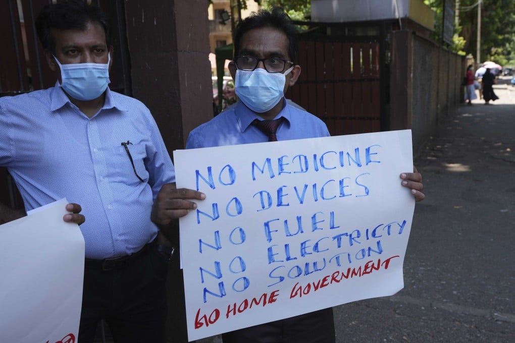 Sri Lankan government medical officers protest outside a hospital in Colombo. Professional medical organisations are warning that people will die as emergency treatment will soon not be possible if drugs and equipment are not received urgently. Photo: AP