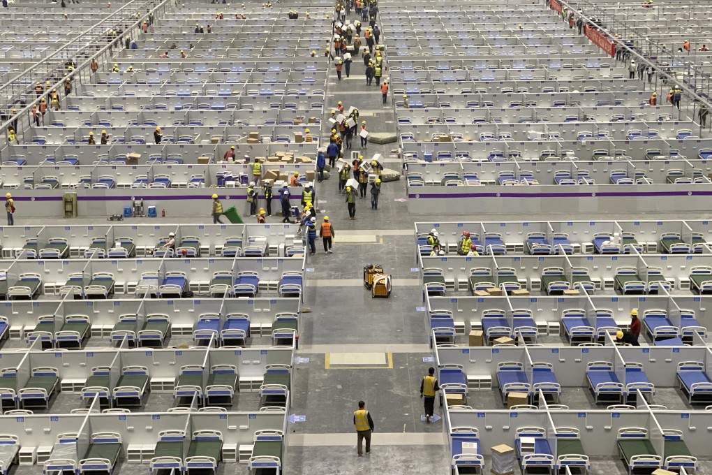 Workers prepare a temporary hospital at the National Exhibition and Convention Centre in Shanghai.Photo: AP