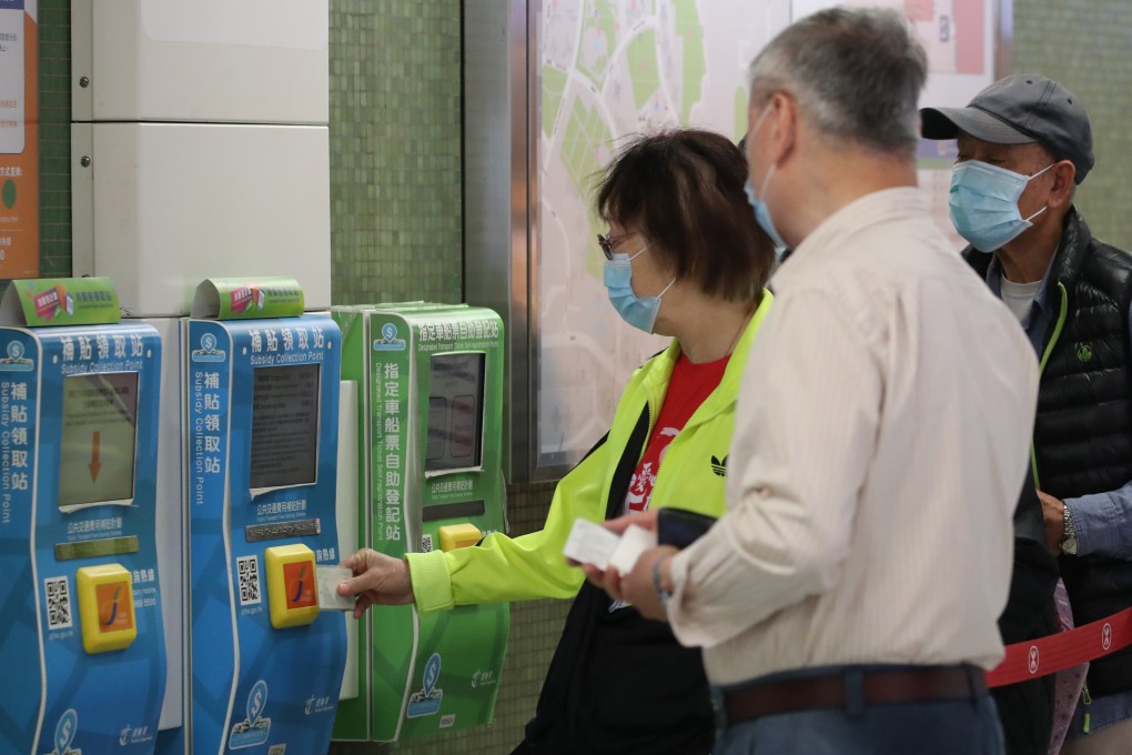 People line up to collect their consumption vouchers (by tapping their Octopus cards) at  Lok Fu MTR Station. Photo: SCMP/ Edmond So
