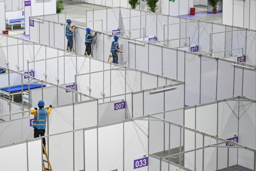 Workers convert a convention and exhibition centre in Guangzhou into a makeshift Covid-19 hospital. Photo: CNS via Reuters