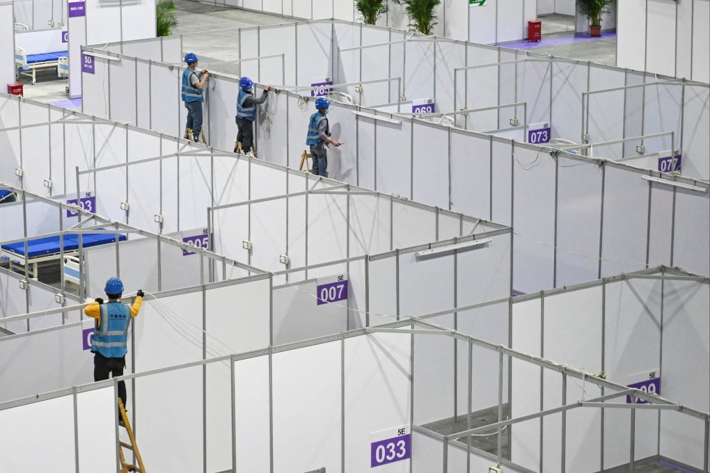 Workers convert a convention and exhibition centre in Guangzhou into a makeshift Covid-19 hospital. Photo: CNS via Reuters