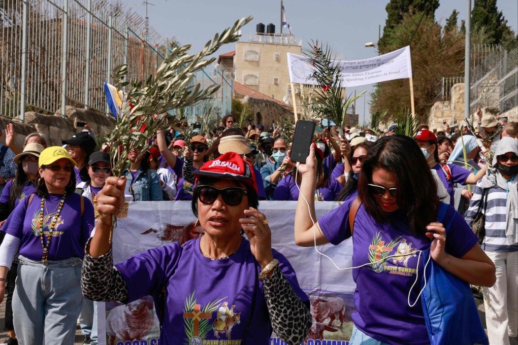 Christians take part in the traditional Palm Sunday procession from the Mount of Olives to Jerusalem’s Old City, on April 10. Photo: AFP