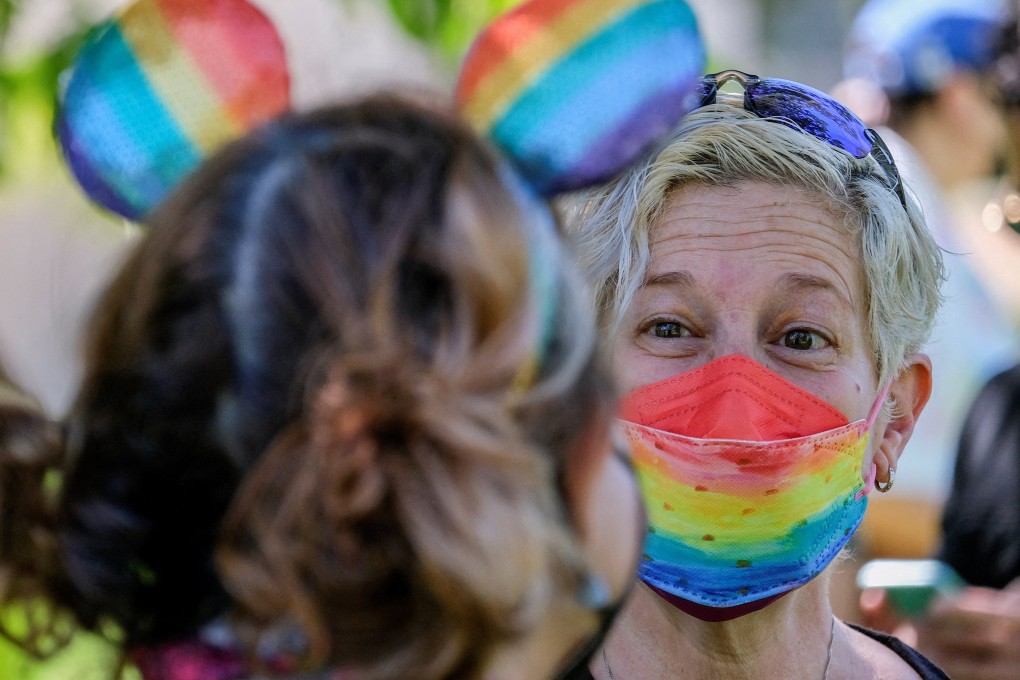 A demonstrator wearing a rainbow-colour face mask takes part in a protest as Disney’s employees demonstrate against Florida’s “Don’t Say Gay” bill, in Glendale, California, on March 22. Photo: Reuters