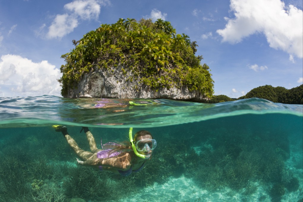 A tourist snorkels in the waters of Palau, an island country in the western Pacific Ocean that has launched a sustainable tourism initiative that rewards visitors who show  “responsible and regenerative behaviour”. Photo: Ullstein Bild via Getty Images