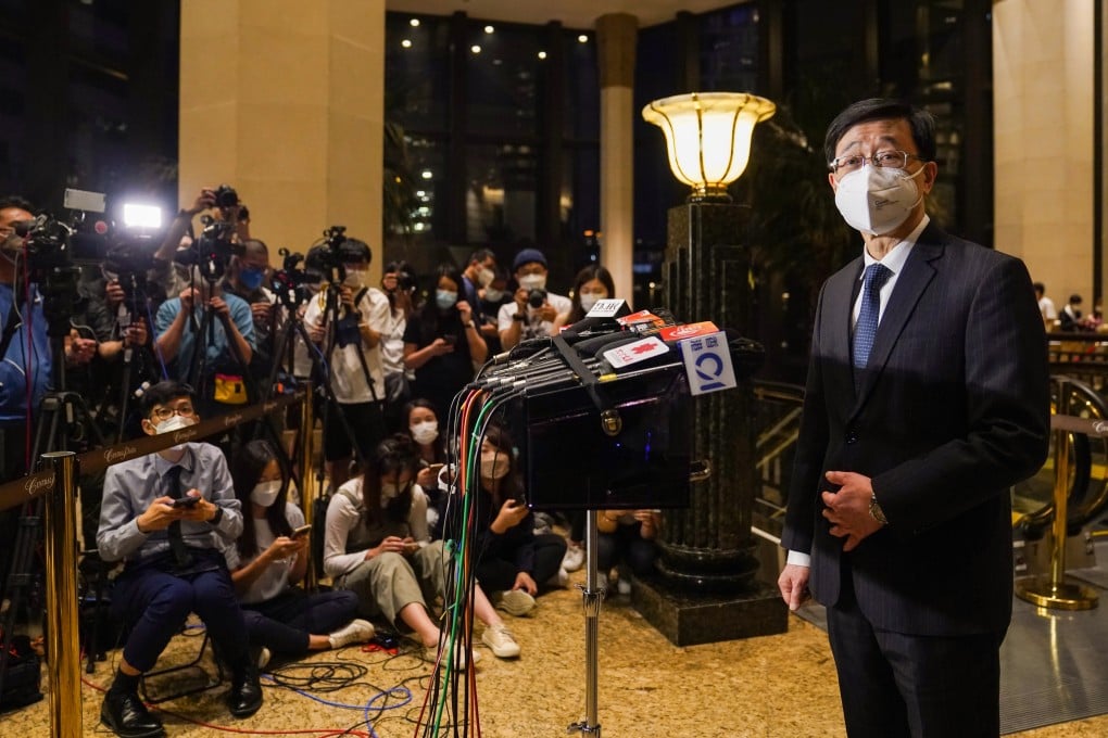 Chief executive hopeful John Lee meets the press at Central Plaza in Wan Chai on Tueday. Photo: Sam Tsang