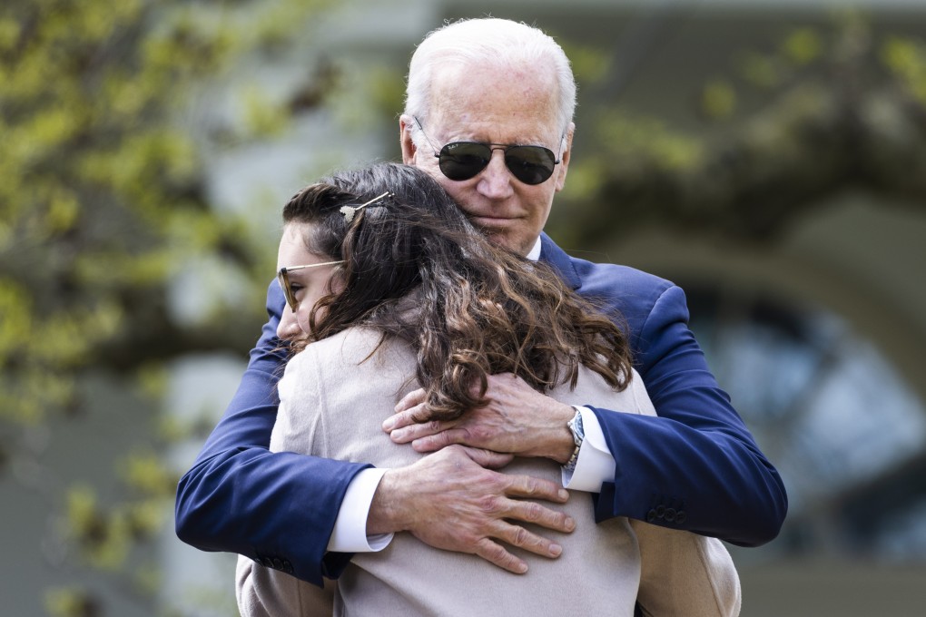 US President Joe Biden hugs Mia Tretta, who was a victim of gun violence, after announcing executive actions to crack down on so-called ghost guns at the White House on Monday. Photo: EPA-EFE