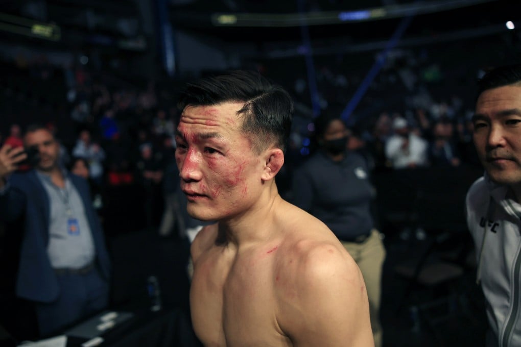 Chan Sung Jung, better known as “the Korean Zombie,” leaves the arena after defeated by Alexander Volkanovski in the fourth round in the featherweight title bout at UFC 273 in Jacksonville, Fla., Saturday, April 9, 2022. Photo: Corey Perrine/The Florida Times-Union via AP