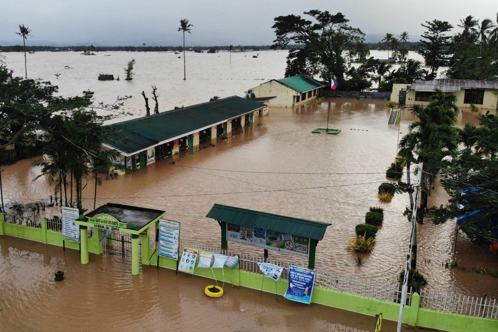 School buildings are submerged by floodwaters in Abuyog town in the Philippines on Monday. Photo: AFP